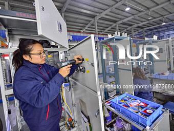 A worker works at a workshop of a water supply equipment manufacturing company in Qingzhou, China, on December 16, 2024. (