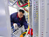 A worker works at a workshop of a water supply equipment manufacturing company in Qingzhou, China, on December 16, 2024. (