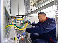 A worker works at a workshop of a water supply equipment manufacturing company in Qingzhou, China, on December 16, 2024. (