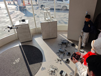 Customers try out drone products at the DJI flagship store in Shanghai, China, on December 16, 2024. (