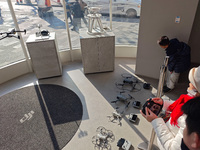 Customers try out drone products at the DJI flagship store in Shanghai, China, on December 16, 2024. (