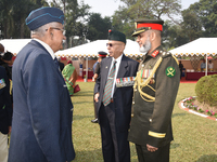 Bangladesh military officer Aminur Rahman (right) and Indian retired officer delegates place a wreath and pay tribute on the occasion of 'Vi...