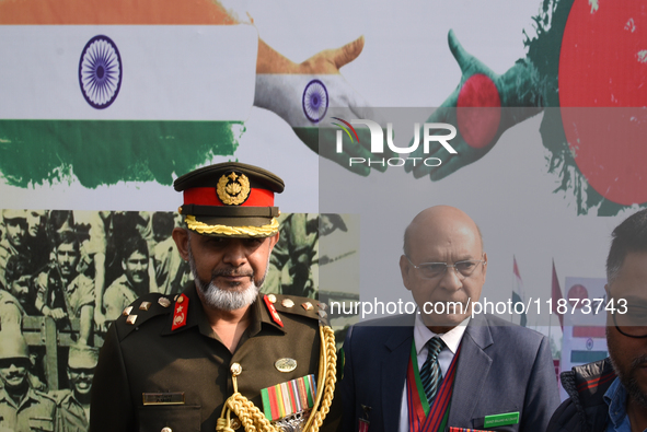 Bangladesh military officer Aminur Rahman (left) pays tribute by placing a wreath on the occasion of 'Vijay Diwas' at the Eastern Command he...