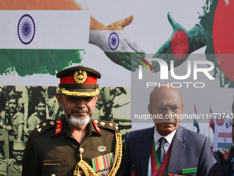 Bangladesh military officer Aminur Rahman (left) pays tribute by placing a wreath on the occasion of 'Vijay Diwas' at the Eastern Command he...