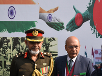 Bangladesh military officer Aminur Rahman (left) pays tribute by placing a wreath on the occasion of 'Vijay Diwas' at the Eastern Command he...