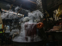 Ashiq Hussain Posh dyes threads inside a dyeing center in Srinagar, Jammu and Kashmir, on December 16, 2024. Kashmiris dye fabric and thread...