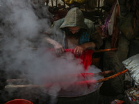 Ashiq Hussain Posh dyes threads inside a dyeing center in Srinagar, Jammu and Kashmir, on December 16, 2024. Kashmiris dye fabric and thread...