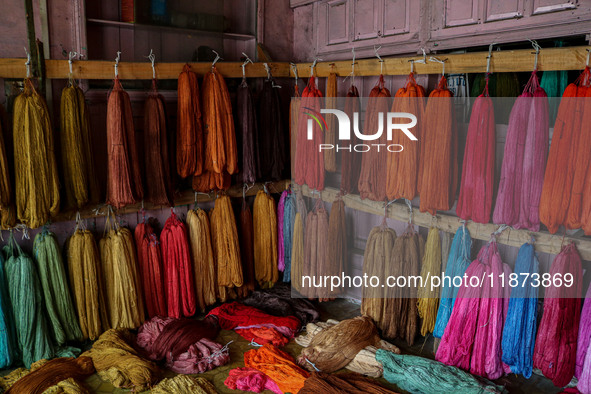 Threads left to dry are seen inside a dyeing center in Srinagar, Jammu and Kashmir, on December 16, 2024. Kashmiris dye fabric and threads m...