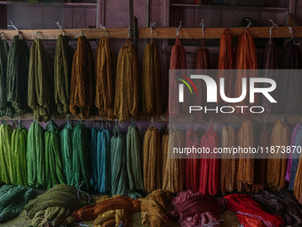 Threads left to dry are seen inside a dyeing center in Srinagar, Jammu and Kashmir, on December 16, 2024. Kashmiris dye fabric and threads m...