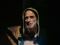 Ashiq Hussain Posh poses for a photograph inside a dyeing center in Srinagar, Jammu and Kashmir, on December 16, 2024. Kashmiris dye fabric...