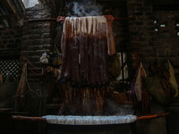 Ashiq Hussain Posh dyes threads inside a dyeing center in Srinagar, Jammu and Kashmir, on December 16, 2024. Kashmiris dye fabric and thread...