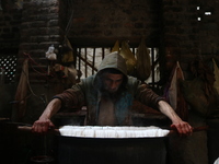 Ashiq Hussain Posh dyes threads inside a dyeing center in Srinagar, Jammu and Kashmir, on December 16, 2024. Kashmiris dye fabric and thread...