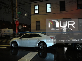 NYPD crime scene investigators investigate where a 32-year-old woman is found dead and a 49-year-old man is wounded in a shooting in College...