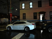 NYPD crime scene investigators investigate where a 32-year-old woman is found dead and a 49-year-old man is wounded in a shooting in College...