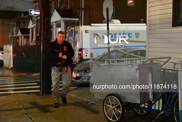 NYPD crime scene investigators investigate where a 32-year-old woman is found dead and a 49-year-old man is wounded in a shooting in College...