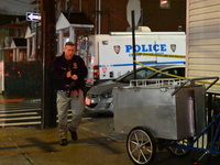 NYPD crime scene investigators investigate where a 32-year-old woman is found dead and a 49-year-old man is wounded in a shooting in College...