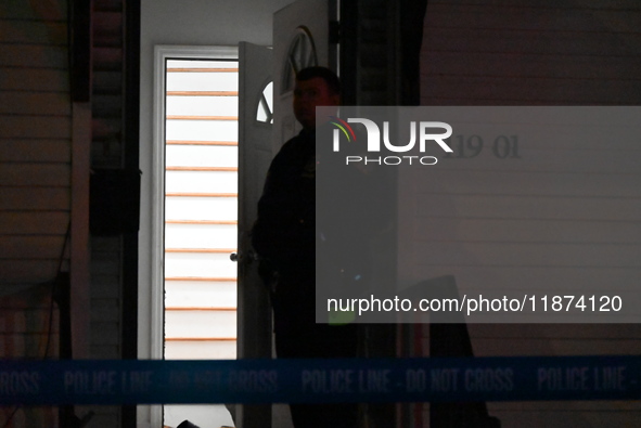 NYPD crime scene investigators investigate where a 32-year-old woman is found dead and a 49-year-old man is wounded in a shooting in College...