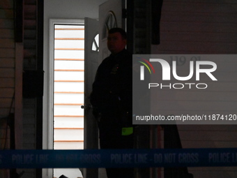 NYPD crime scene investigators investigate where a 32-year-old woman is found dead and a 49-year-old man is wounded in a shooting in College...