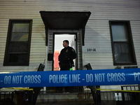 NYPD crime scene investigators investigate where a 32-year-old woman is found dead and a 49-year-old man is wounded in a shooting in College...