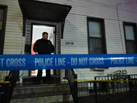 NYPD crime scene investigators investigate where a 32-year-old woman is found dead and a 49-year-old man is wounded in a shooting in College...