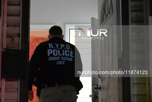 NYPD crime scene investigators investigate where a 32-year-old woman is found dead and a 49-year-old man is wounded in a shooting in College...