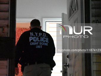 NYPD crime scene investigators investigate where a 32-year-old woman is found dead and a 49-year-old man is wounded in a shooting in College...