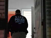 NYPD crime scene investigators investigate where a 32-year-old woman is found dead and a 49-year-old man is wounded in a shooting in College...