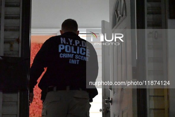 NYPD crime scene investigators investigate where a 32-year-old woman is found dead and a 49-year-old man is wounded in a shooting in College...