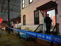 NYPD crime scene investigators investigate where a 32-year-old woman is found dead and a 49-year-old man is wounded in a shooting in College...