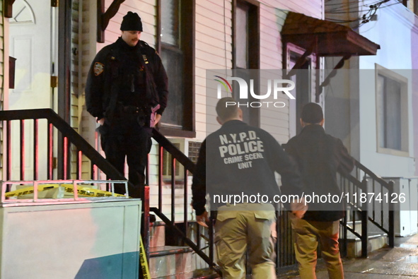 NYPD crime scene investigators investigate where a 32-year-old woman is found dead and a 49-year-old man is wounded in a shooting in College...