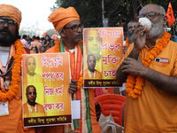 Members of Hindu Suraksha Samiti shout slogans during a protest against the recent arrest of ISKCON Bangladesh priest Chinmoy Krishna Das by...