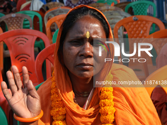 A member of Hindu Suraksha Samiti attends a protest meeting against the recent arrest of ISKCON Bangladesh priest Chinmoy Krishna Das by Dha...