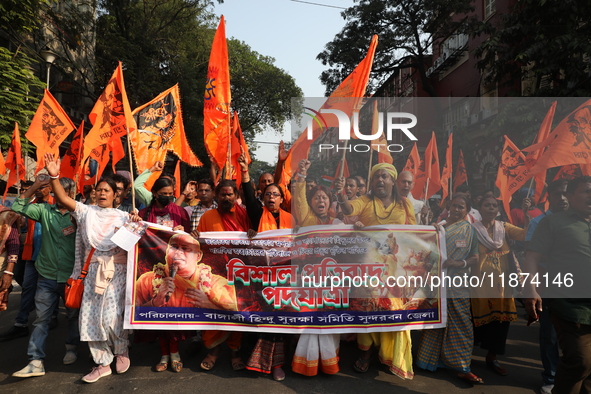 Members of Hindu Suraksha Samiti shout slogans during a protest against the recent arrest of ISKCON Bangladesh priest Chinmoy Krishna Das by...