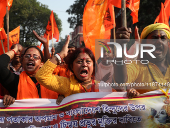 Members of Hindu Suraksha Samiti shout slogans during a protest against the recent arrest of ISKCON Bangladesh priest Chinmoy Krishna Das by...