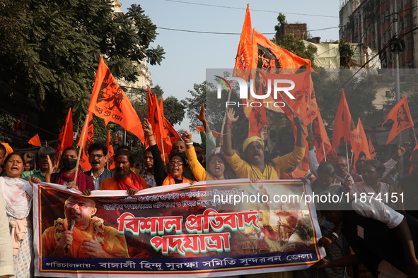 Members of Hindu Suraksha Samiti shout slogans during a protest against the recent arrest of ISKCON Bangladesh priest Chinmoy Krishna Das by...