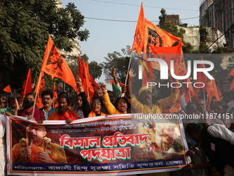 Members of Hindu Suraksha Samiti shout slogans during a protest against the recent arrest of ISKCON Bangladesh priest Chinmoy Krishna Das by...