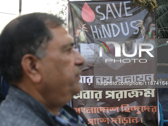 A member of Hindu Suraksha Samiti attends a protest meeting against the recent arrest of ISKCON Bangladesh priest Chinmoy Krishna Das by Dha...