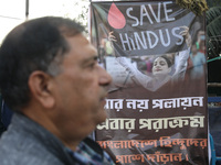 A member of Hindu Suraksha Samiti attends a protest meeting against the recent arrest of ISKCON Bangladesh priest Chinmoy Krishna Das by Dha...