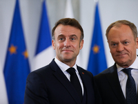 In Warsaw, Poland, on December 12, 2024, French President Emmanuel Macron meets with Polish Prime Minister Donald Tusk at the Chancellery of...