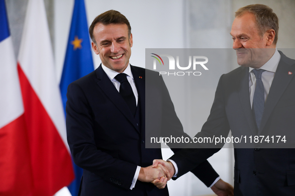 In Warsaw, Poland, on December 12, 2024, French President Emmanuel Macron meets with Polish Prime Minister Donald Tusk at the Chancellery of...