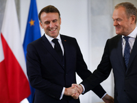 In Warsaw, Poland, on December 12, 2024, French President Emmanuel Macron meets with Polish Prime Minister Donald Tusk at the Chancellery of...