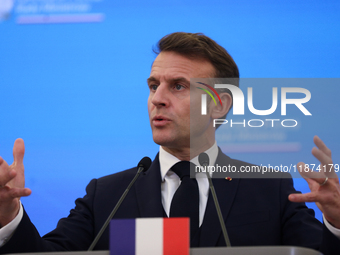 In Warsaw, Poland, on December 12, 2024, French President Emmanuel Macron meets with Polish Prime Minister Donald Tusk at the Chancellery of...