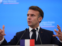 In Warsaw, Poland, on December 12, 2024, French President Emmanuel Macron meets with Polish Prime Minister Donald Tusk at the Chancellery of...