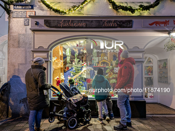 A shop window is festively decorated in Wasserburg am Inn, Bavaria, Germany, on December 15, 2024. 