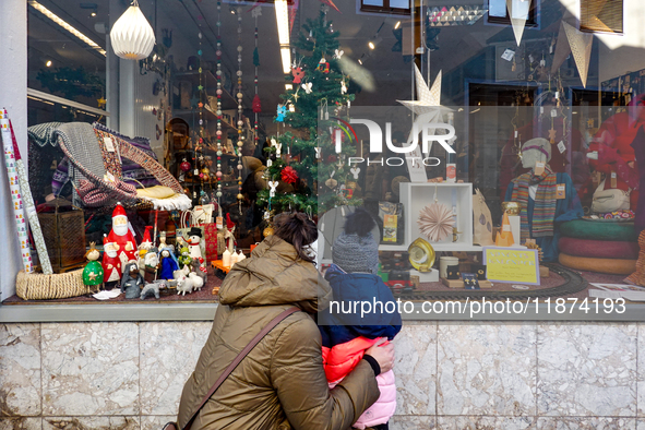 A shop window is festively decorated in Wasserburg am Inn, Bavaria, Germany, on December 15, 2024. 