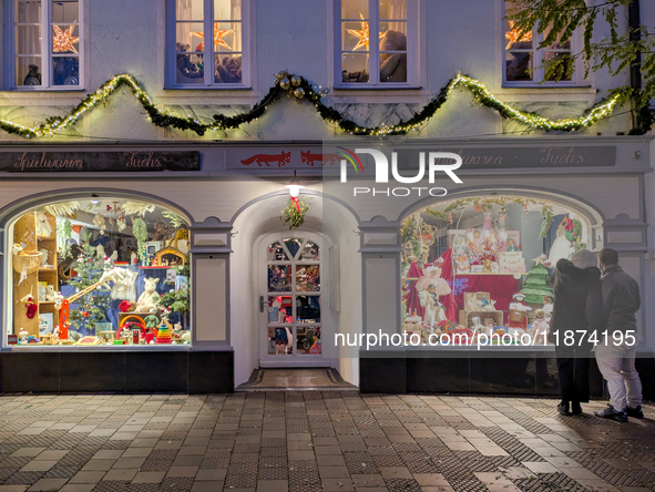 A shop window is festively decorated in Wasserburg am Inn, Bavaria, Germany, on December 15, 2024. 