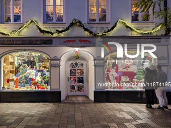 A shop window is festively decorated in Wasserburg am Inn, Bavaria, Germany, on December 15, 2024. (