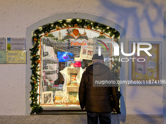 A shop window is festively decorated in Wasserburg am Inn, Bavaria, Germany, on December 15, 2024. (