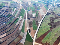 Stacked rice terraces formed by barren mountains are seen in Zaozhuang, China, on December 15, 2024. (