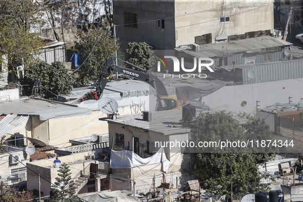 Jerusalem Municipality Machinery Demolished 11 Residential And Commercial Structures Today, December 16, 2024, In The Town Of Silwan, South...